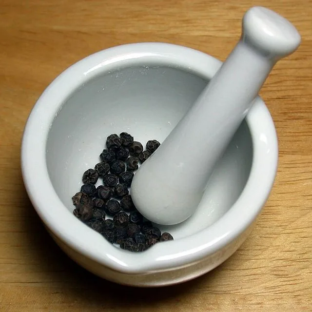 Whole black peppercorns
